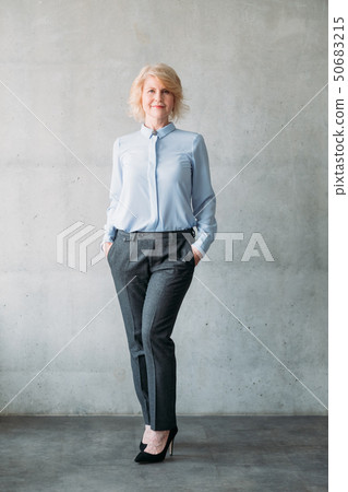 senior lady hands pockets confident business ceo 50683215