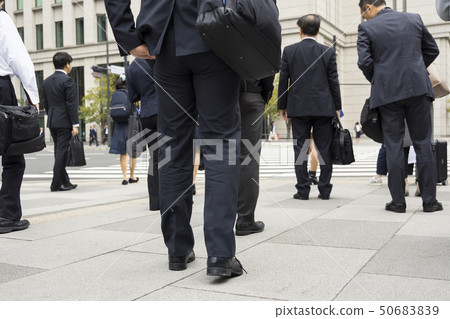 Businessmen waiting for traffic lights Businessmen waiting for traffic lights 50683839