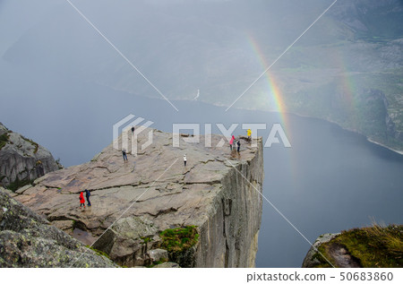 Preikestolen Pulpit Rock with double rainbow in the background a Lysefjord underneath Preikestolen Pulpit Rock with double rainbow in the background a Lysefjord underneath 50683860