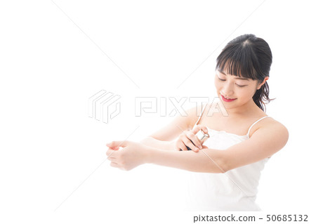 Young woman painting a cream Young woman painting a cream 50685132