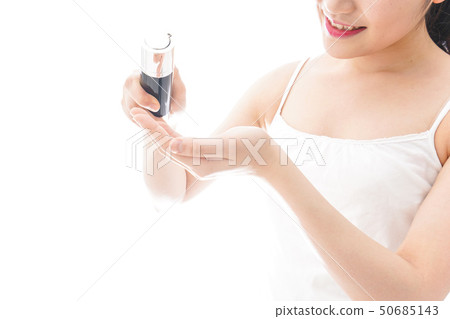 Young woman painting a cream Young woman painting a cream 50685143