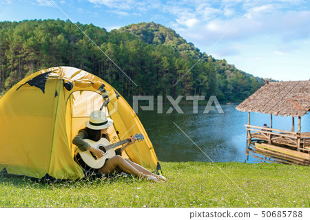 Happy traveler lifestyle women on vacation camping 50685788