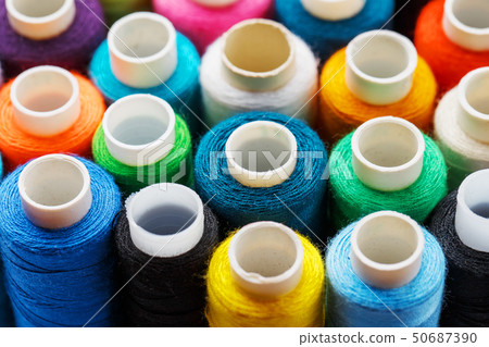 Colorful spools of sewing thread. Colored thread 50687390