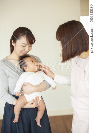 Nurse and baby 50688080