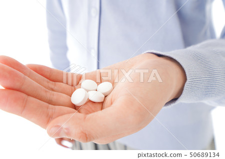 Young lady taking medicine · supplement Young lady taking medicine · supplement 50689134