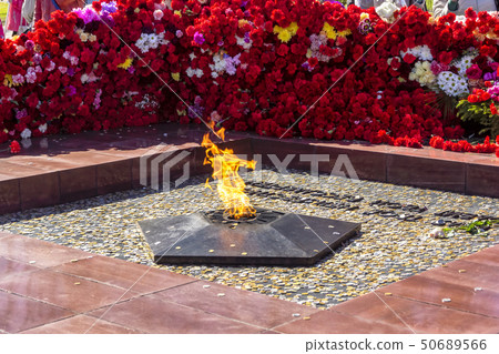 Wall of flowers at the memorial eternal flame on V Wall of flowers at the memorial eternal flame on V 50689566
