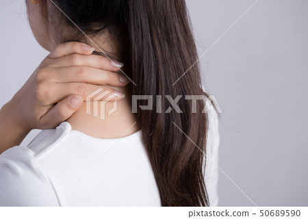 Closeup woman neck and shoulder pain and injury. 50689590