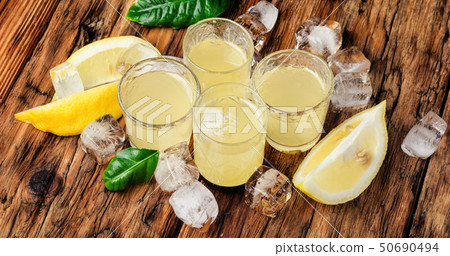 Italian limoncello with fresh lemons 50690494