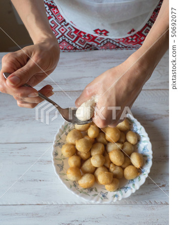 Preparation of traditional Greek sweet Loukoumades Preparation of traditional Greek sweet Loukoumades 50692077