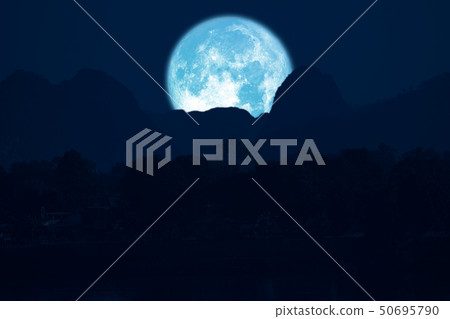 rose moon on night sky back over silhouette 50695790