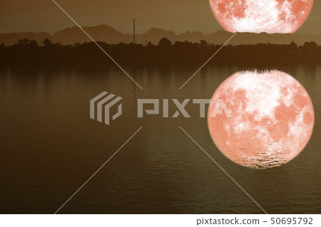 reflection on river of strawberry moon on night reflection on river of strawberry moon on night 50695792