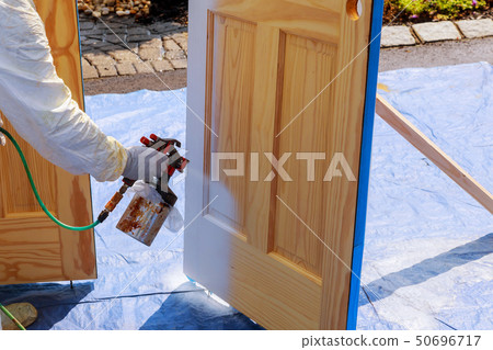 Master painting wood doors with spray gun Master painting wood doors with spray gun 50696717