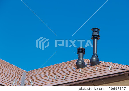 Plastic Fume Hood and exhaust pipe on Residential Building Roof Plastic Fume Hood and exhaust pipe on Residential Building Roof 50698127
