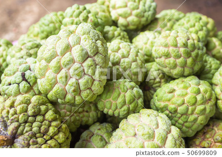 Custard apple is stacked together in the bazaar. Custard apple is stacked together in the bazaar. 50699809