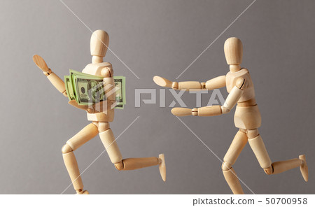 Stealing money. The thief with money runs away from the person 50700958