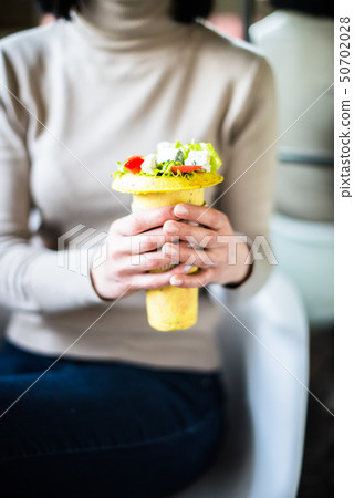 Woman holding healthy salad in her hands  50702028