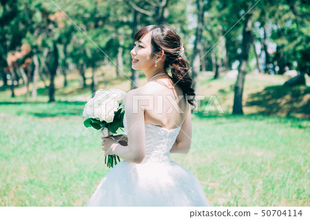 Women in a wedding dress Women in a wedding dress 50704114