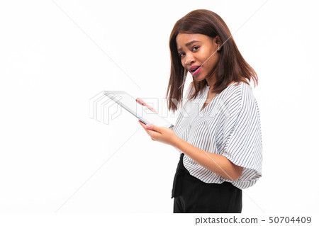 portrait of african young girl possing with grey tablet in hands on background 50704409