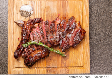 food, delicious, horse meat and craft concept - serving of grilled steak 50704438