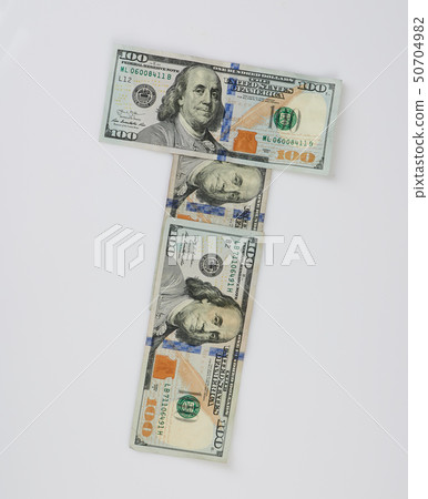 T letter made from 100 dollar bills  50704982