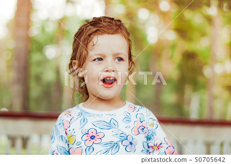 little girl joyful on the street 50705642