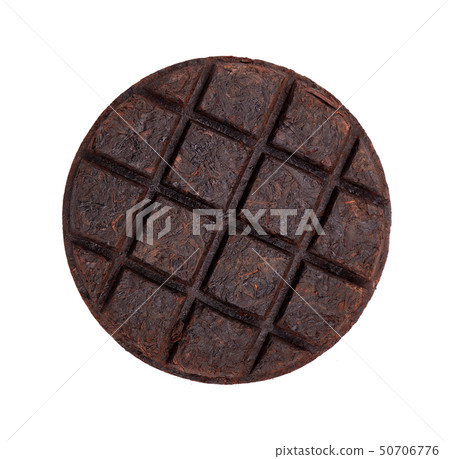 Round flat disc of puer tea isolated on white background. Chinese tea Shou Puer. Pressed fermented 50706776