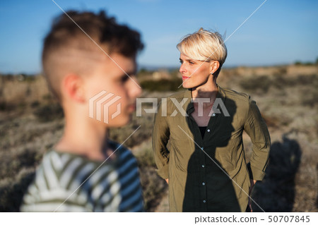 Mother with son standing outdoors in nature in the Mediterranean. Mother with son standing outdoors in nature in the Mediterranean. 50707845