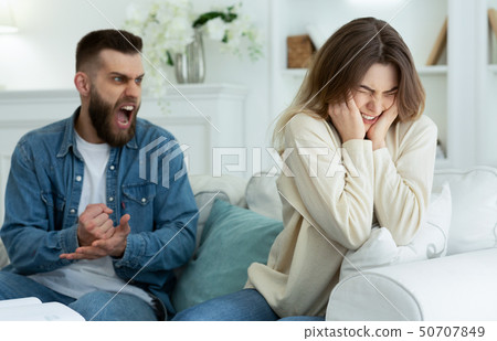 Couple Arguing. Husband Shouting To Desperate Wife Couple Arguing. Husband Shouting To Desperate Wife 50707849