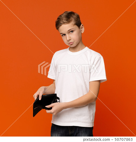 Sad teen boy showing old empty wallet 50707863