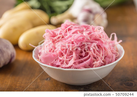 Sour cabbage with potatoes and garlic on wooden 50709244
