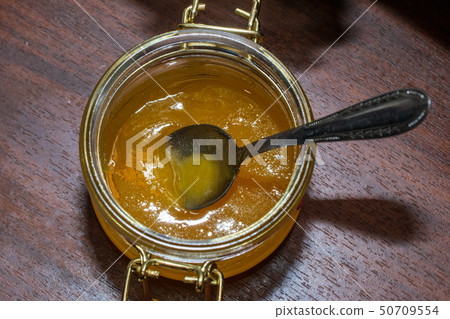 Spoon in a jar of honey 50709554