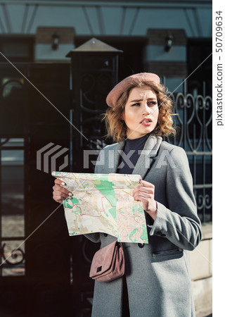 Cute young beautiful curly confused caucasian 50709634