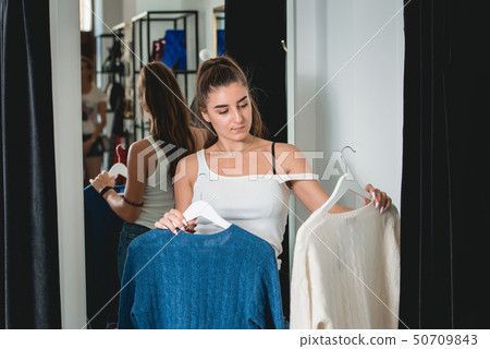 Smiling young beautiful woman shopping, i a Smiling young beautiful woman shopping, i a 50709843