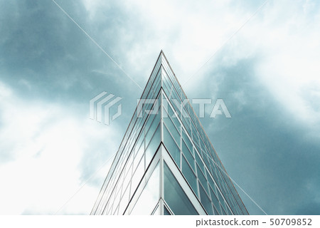 triangle shaped structure against a blue cloudy 50709852