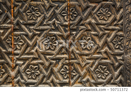 Patterns on the doors of the palace in India 50711372