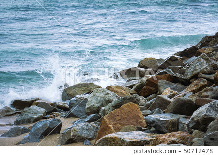 Stone In Green Sea With Wave Stone In Green Sea With Wave 50712478