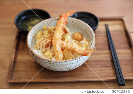 Tempura donburi , Fried shrimp tempura on rice japanese food on wooden table Tempura donburi , Fried shrimp tempura on rice japanese food on wooden table 50712820