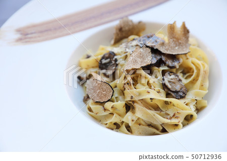 pasta with black truffles on wood background , Italian food pasta with black truffles on wood background , Italian food 50712936