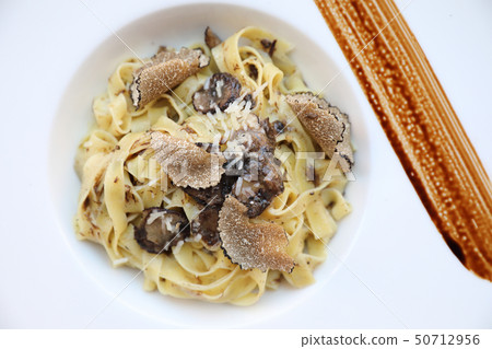 pasta with black truffles on wood background , Italian food pasta with black truffles on wood background , Italian food 50712956