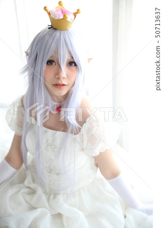 Portrait of vampire dracula young woman dress in white tone room halloween concept 50713637