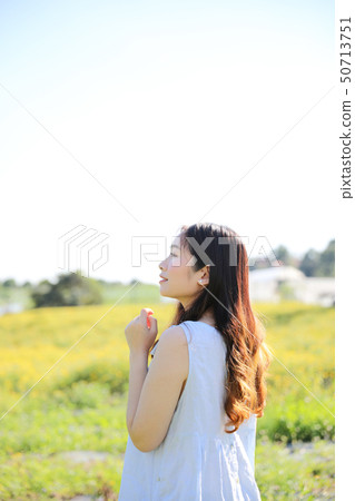 Portrait of Young Asian woman girl smile in flower garden Portrait of Young Asian woman girl smile in flower garden 50713751