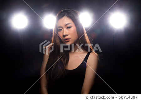 Fashion Asian Woman dark smoke back rim light 50714397