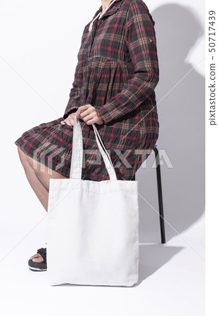Girl is holding bag canvas fabric for mockup blank Girl is holding bag canvas fabric for mockup blank 50717439