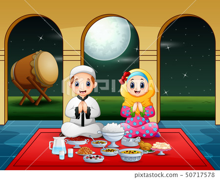 Muslim couple pray together before break fasting Muslim couple pray together before break fasting 50717578