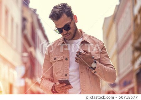 Young Adult Man Smartphone on Public Summer Time 50718577