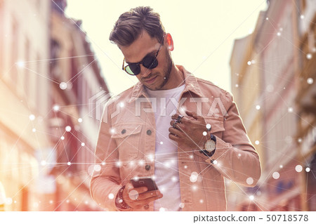 Young Adult Man Using Social Media on Smartphone - 50718578
