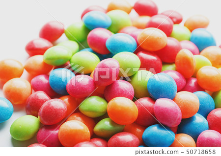 A rainbow of color from multicolored candies A rainbow of color from multicolored candies 50718658