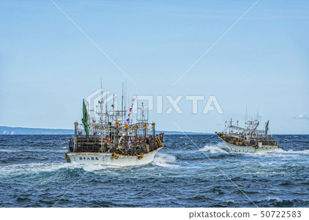 Squid fishing boat leaving port Squid fishing boat leaving port 50722583