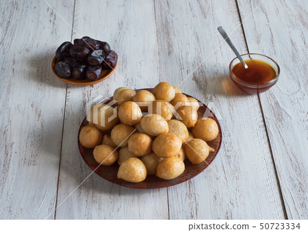 Luqaimat - traditional sweet dumplings of UAE. Luqaimat - traditional sweet dumplings of UAE. 50723334