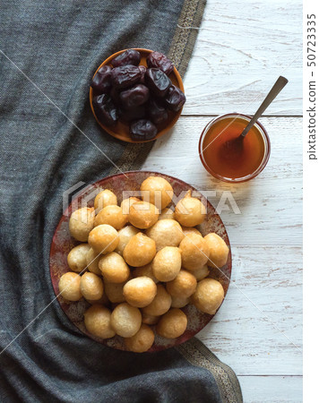 Luqaimat - traditional sweet dumplings of UAE. 50723335
